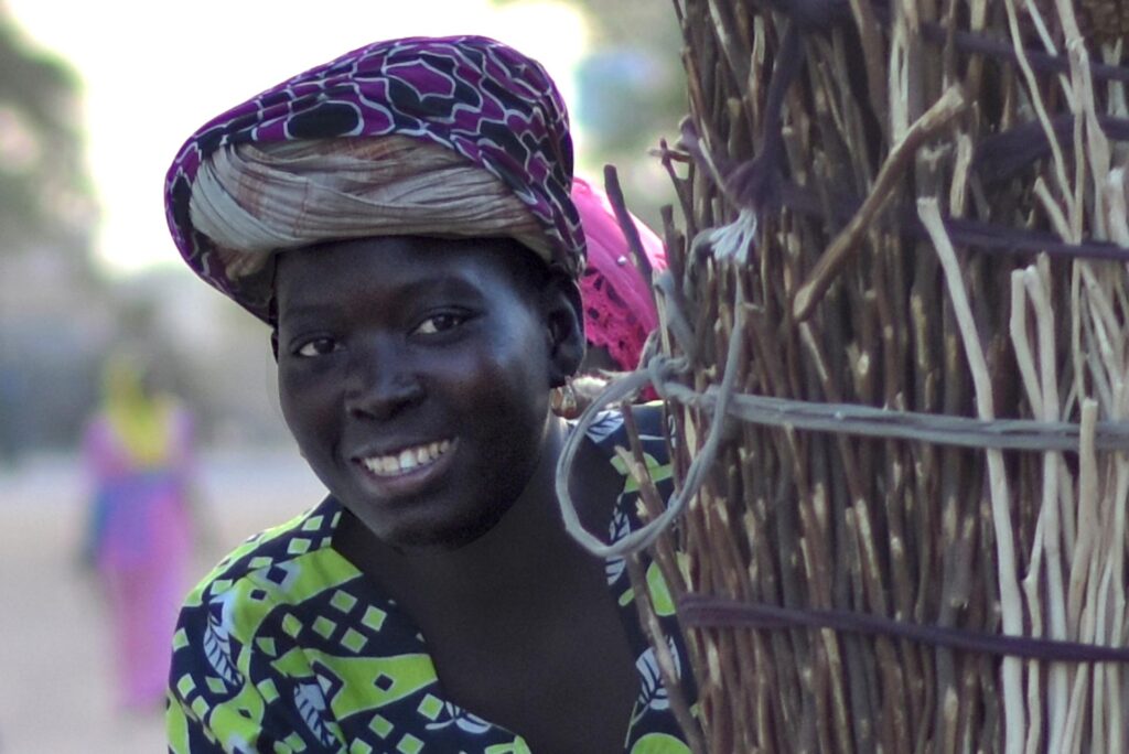 Woman outside in Senegal with headwrap.