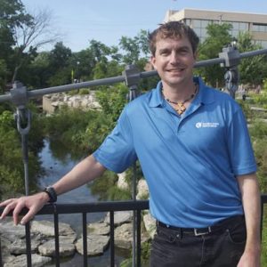 Headshot of board of directors member Adam Beckett outside.